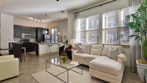 Living Room With Kitchen View at Optimist Lofts, Atlanta, GA