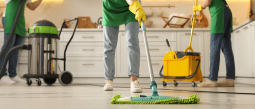 A group of people cleaning an apartment before moving out.