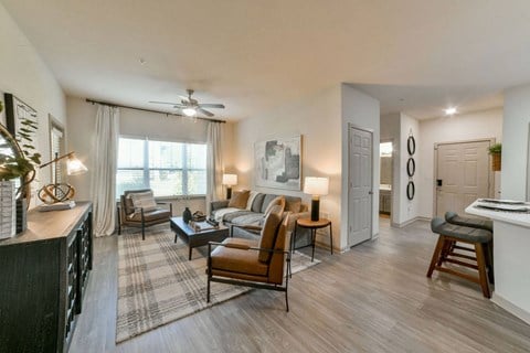 Gorgeous Modern Living Room with Two Tone Paint Colors and Wood Plank Vinyl Flooring (in Select Units) at Ashby at Ross Bridge, Hoover
