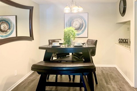 a dining area with model furnishings and decor at Hills at Hoover 35216