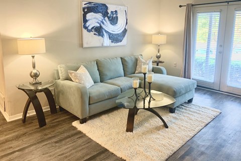 a living room with model furnishings at Hills at Hoover 35216
