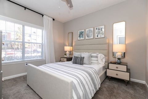a bedroom with a bed and a large window at Willowest in Collier Hills, Georgia, 30318